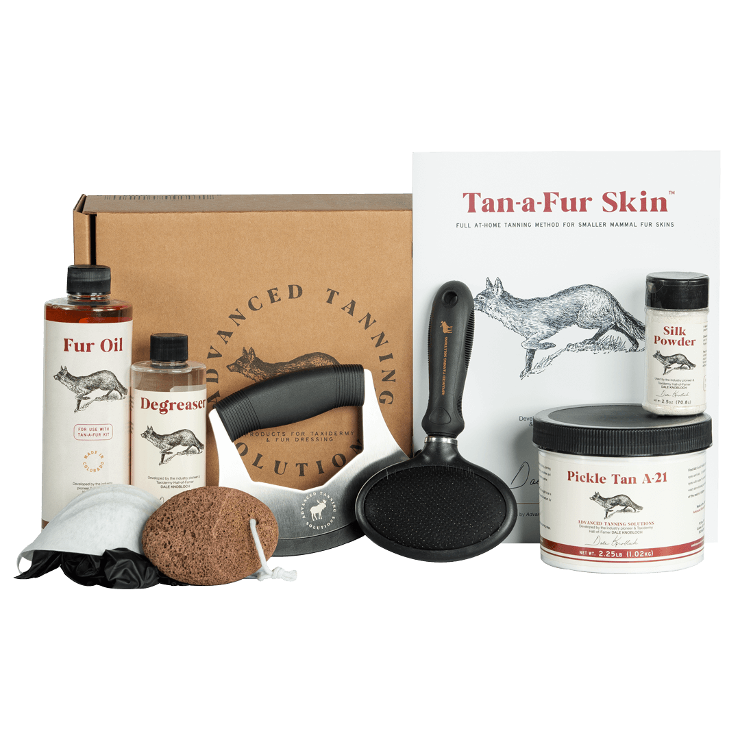 Advanced Tanning Solutions Tan-A-Fur Skin kit including Fur Oil, Degreaser, Pickle Tan A-21, Silk Powder, and fleshing tool. 